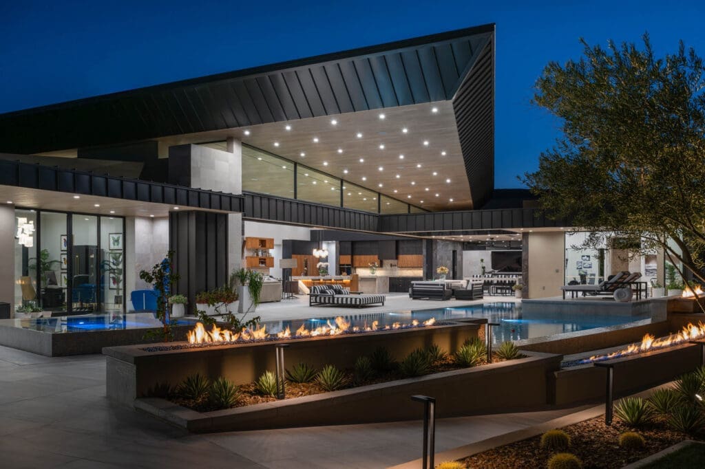 Luxury custom home in The Ridges Summerlin featuring modern architecture, expansive outdoor living spaces, fire features, and a resort-style pool.